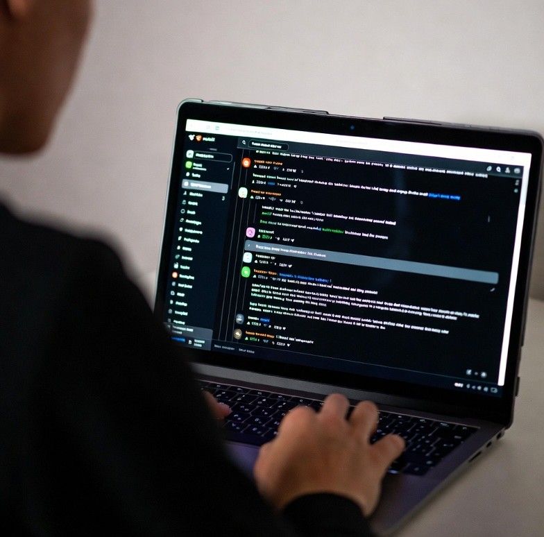 analyzing a Reddit thread on a laptop, highlighting comments and upvotes